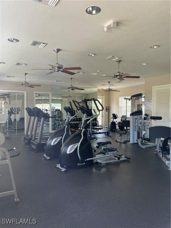 workout area featuring a textured ceiling