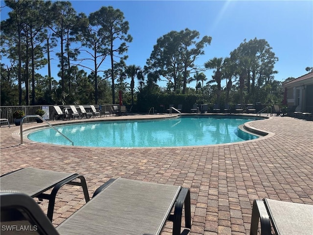 view of swimming pool with a patio area