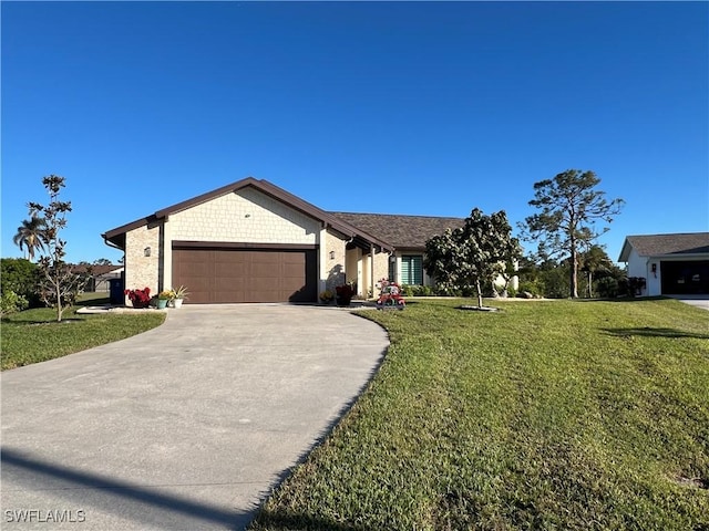 ranch-style house featuring a front lawn and a garage