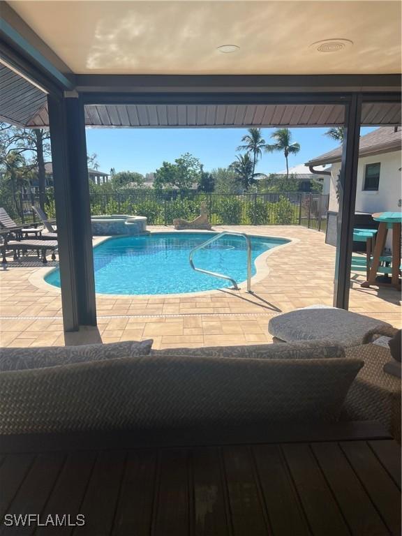 view of swimming pool with a patio area