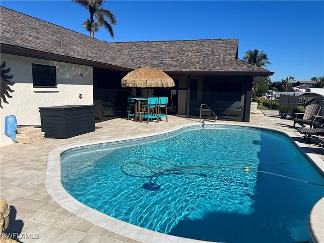 view of swimming pool featuring a patio area