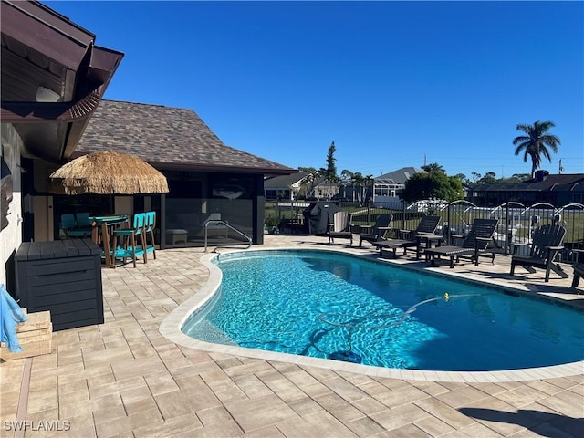 view of swimming pool with a patio area