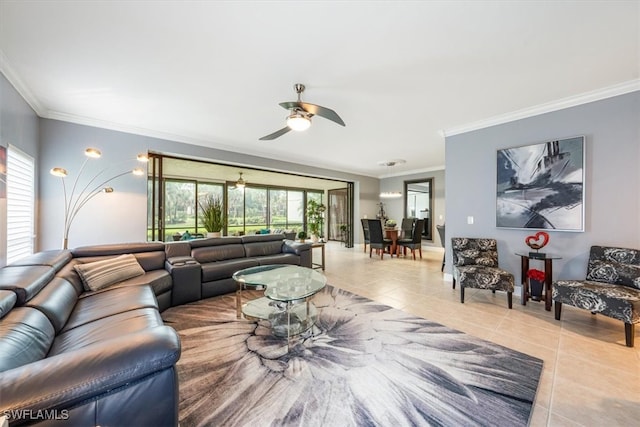 tiled living room with a wealth of natural light, ornamental molding, and ceiling fan