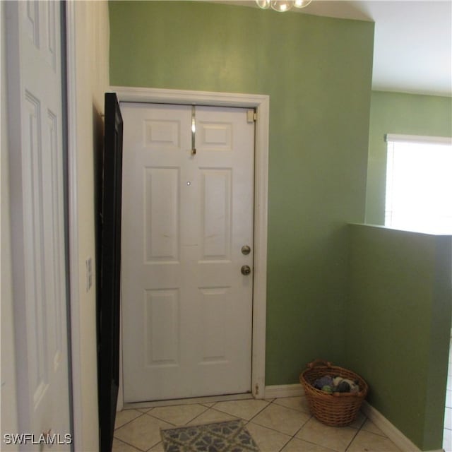 doorway featuring light tile patterned floors