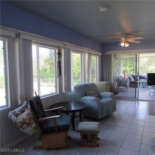 tiled living room featuring ceiling fan