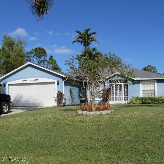 single story home featuring a front yard and a garage