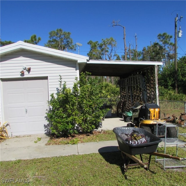 exterior space featuring a garage and a carport