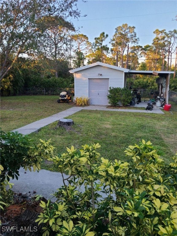 exterior space featuring a garage and an outbuilding