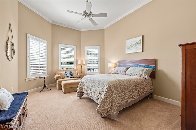 carpeted bedroom with ceiling fan and ornamental molding