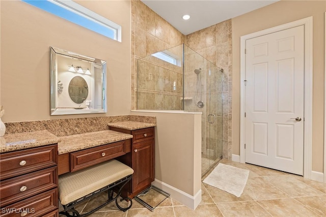 bathroom with vanity, baseboards, recessed lighting, tile patterned floors, and a shower stall