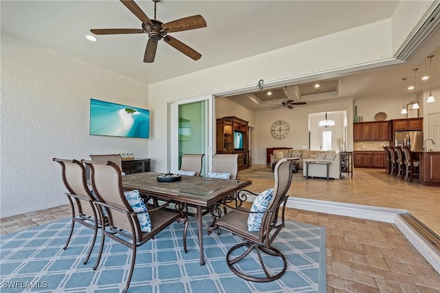 exterior space with a ceiling fan and recessed lighting