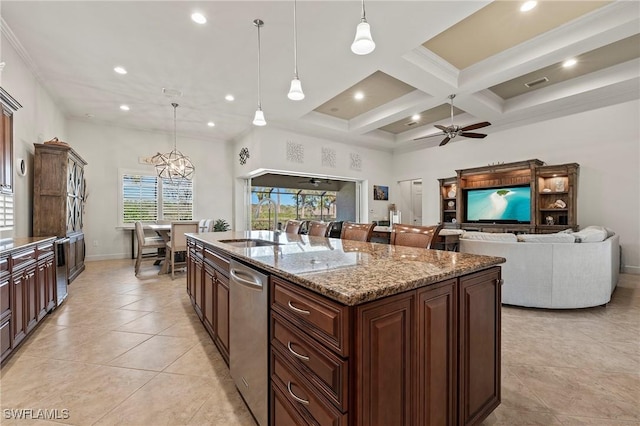 kitchen featuring an island with sink, a sink, coffered ceiling, ceiling fan with notable chandelier, and dishwasher