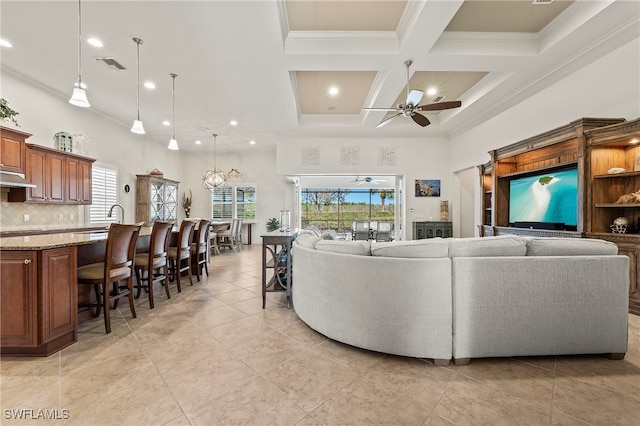 tiled living room featuring ceiling fan, crown molding, a towering ceiling, and coffered ceiling