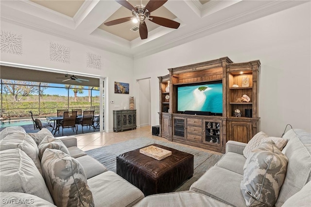 living room featuring visible vents, a ceiling fan, coffered ceiling, and a towering ceiling