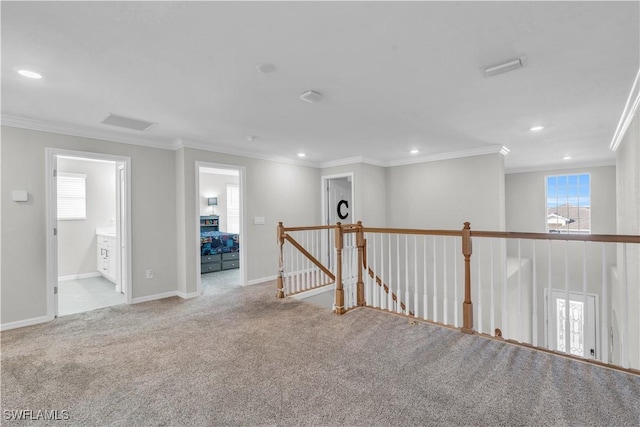 unfurnished room featuring light carpet and ornamental molding