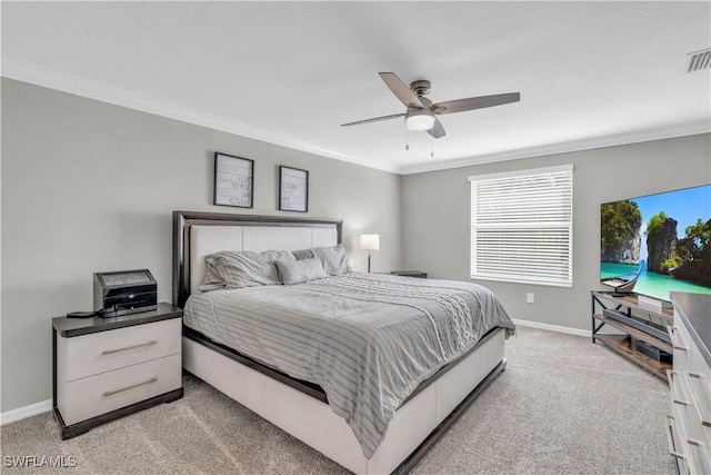 bedroom with ceiling fan, crown molding, and light carpet