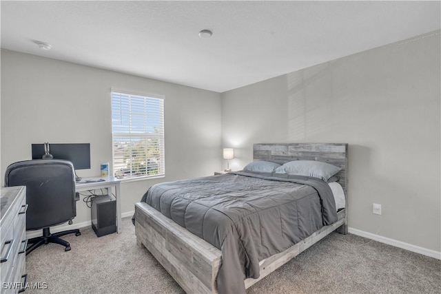 bedroom with light colored carpet