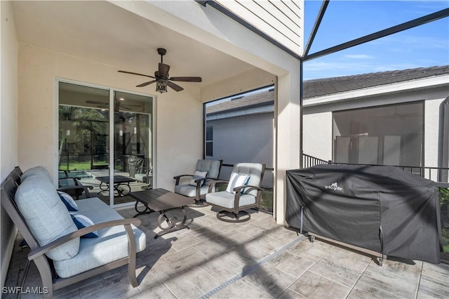 view of patio / terrace featuring a lanai, grilling area, and ceiling fan