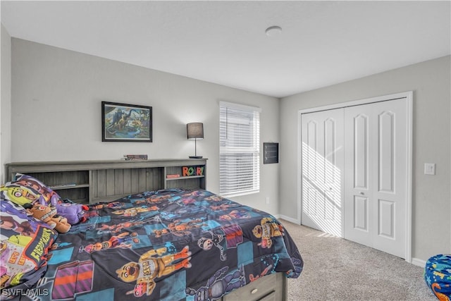 carpeted bedroom featuring a closet