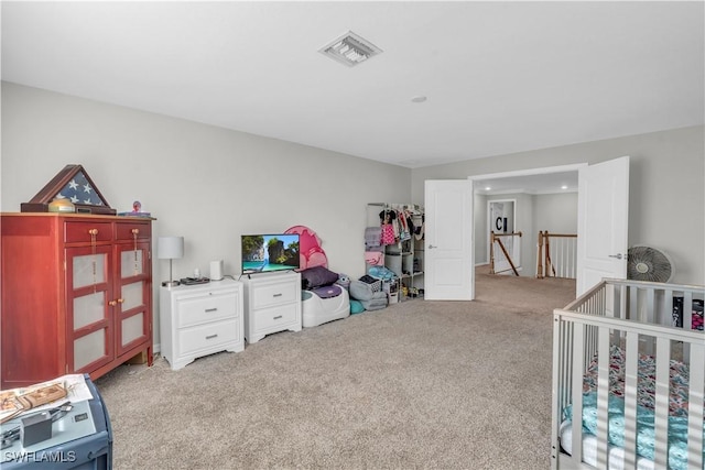 carpeted bedroom with a crib