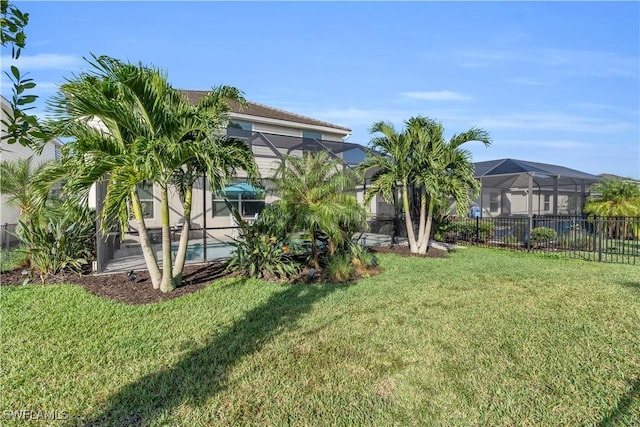 view of yard featuring a lanai and a fenced in pool