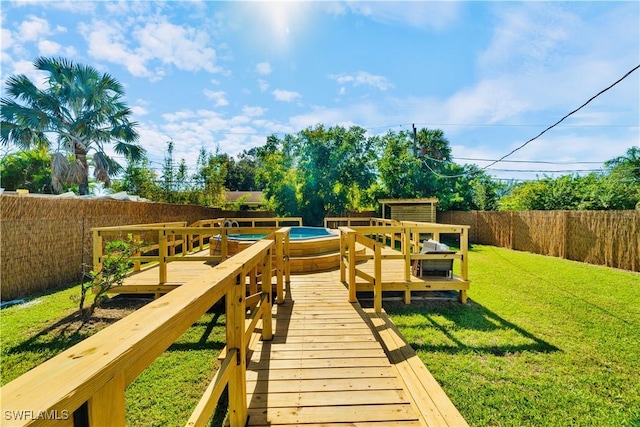 exterior space with a lawn and a swimming pool