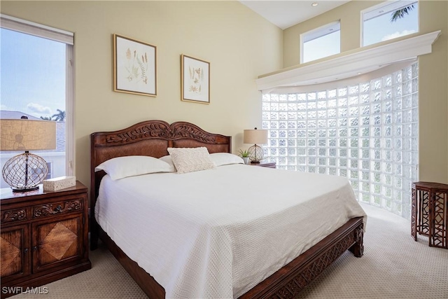 bedroom with light colored carpet