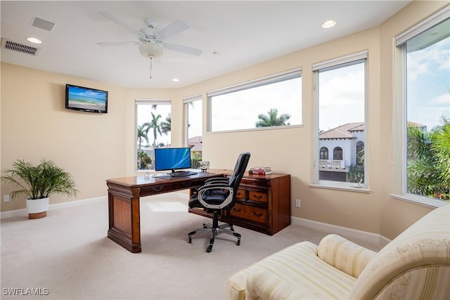 carpeted home office with ceiling fan