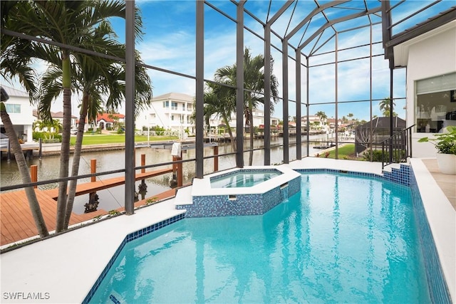 view of pool with glass enclosure, an in ground hot tub, a water view, and a boat dock