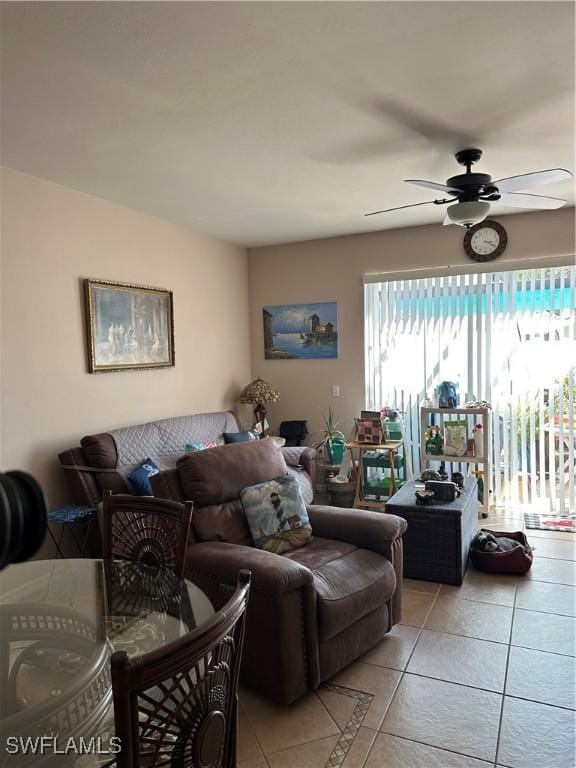 tiled living room with ceiling fan