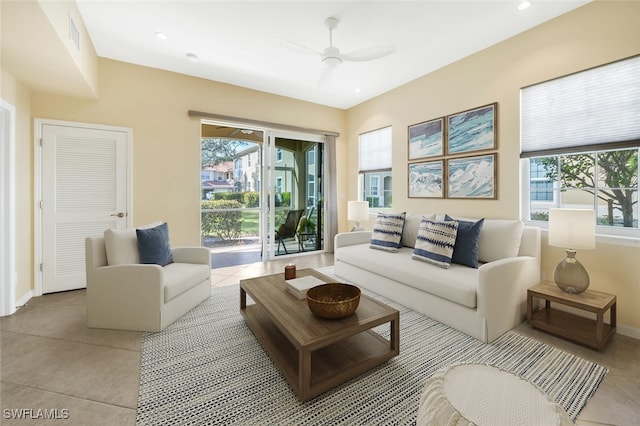 tiled living room featuring ceiling fan