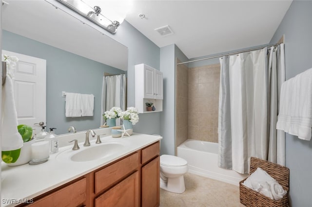 full bathroom featuring tile patterned flooring, vanity, shower / bath combo, and toilet