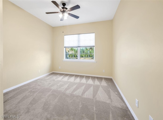 carpeted empty room with ceiling fan