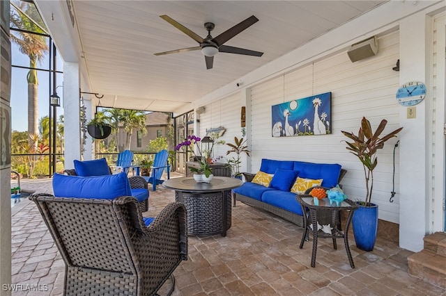 view of patio featuring an outdoor living space and ceiling fan