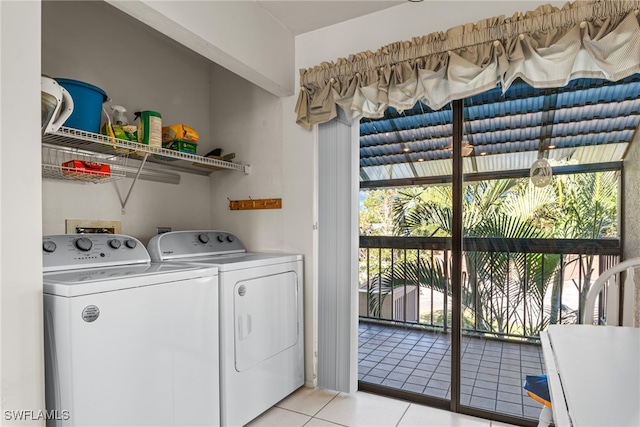 laundry area featuring independent washer and dryer and light tile patterned floors