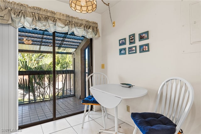 dining room featuring tile patterned floors and electric panel