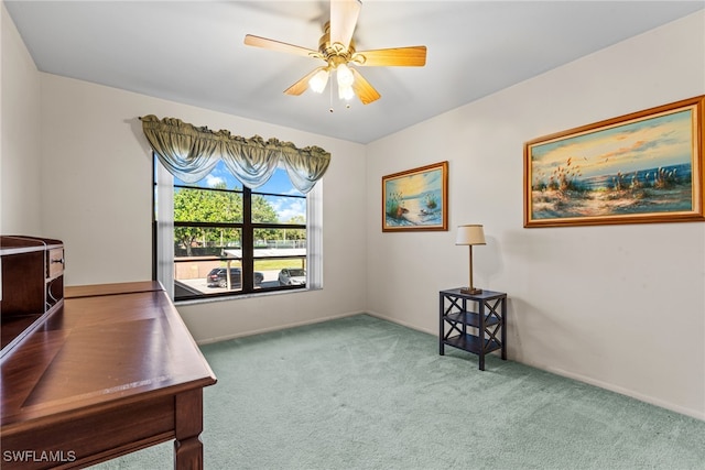 office area with carpet floors and ceiling fan