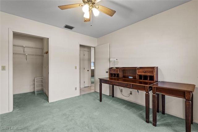 interior space with ceiling fan and carpet floors