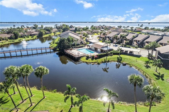 birds eye view of property with a water view