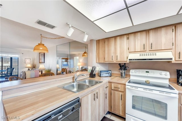 kitchen with kitchen peninsula, sink, pendant lighting, electric range, and light brown cabinets