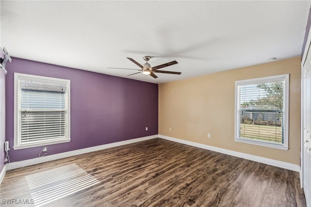 empty room featuring hardwood / wood-style flooring and ceiling fan