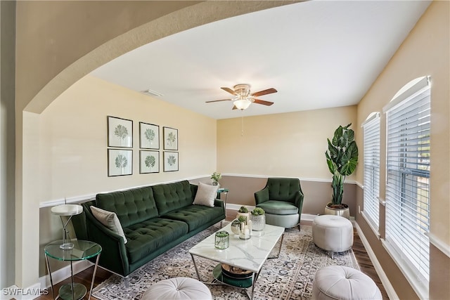 living room with ceiling fan and wood-type flooring