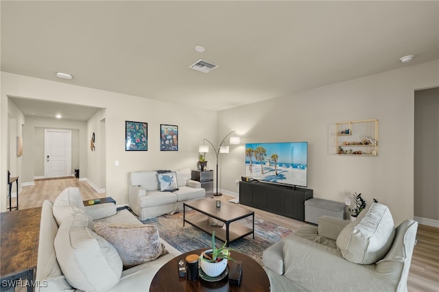 living room with light hardwood / wood-style floors