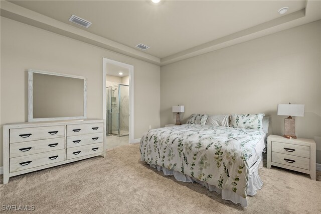 carpeted bedroom with ensuite bathroom