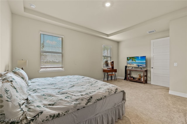 bedroom with light colored carpet