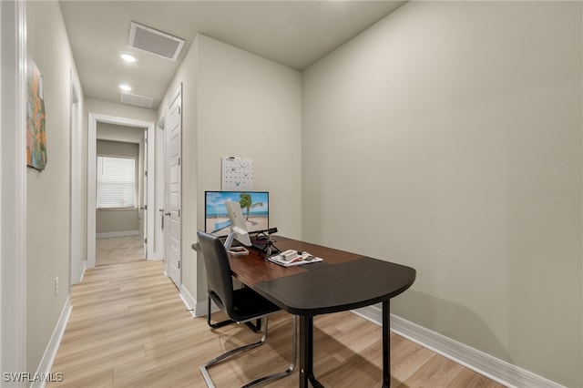 office with light hardwood / wood-style floors