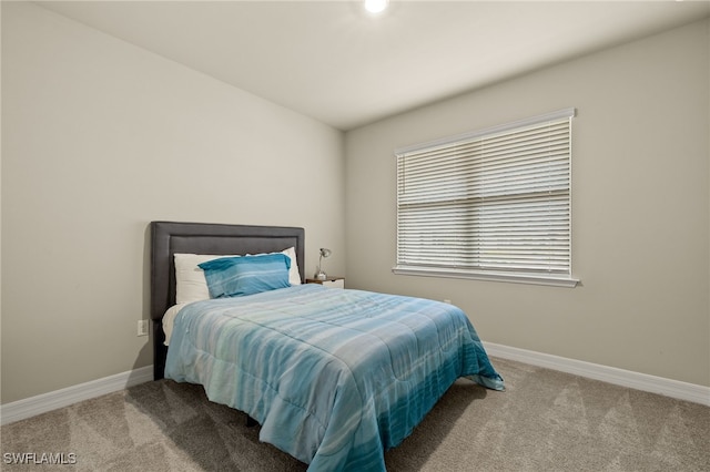 bedroom with light carpet