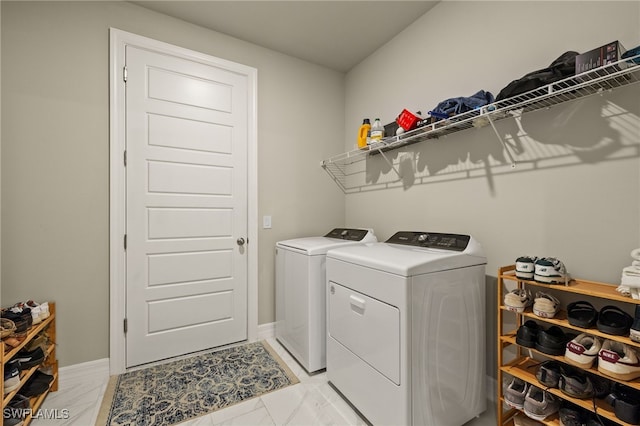 washroom featuring washer and clothes dryer