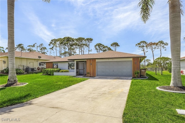 ranch-style home featuring a garage and a front yard