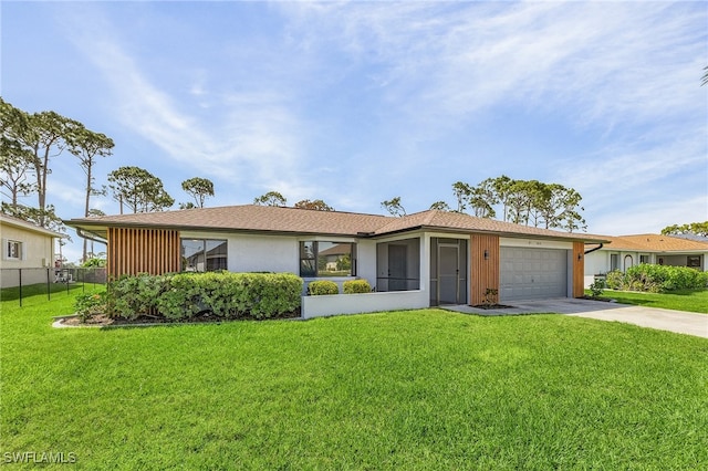 ranch-style house with a garage and a front lawn